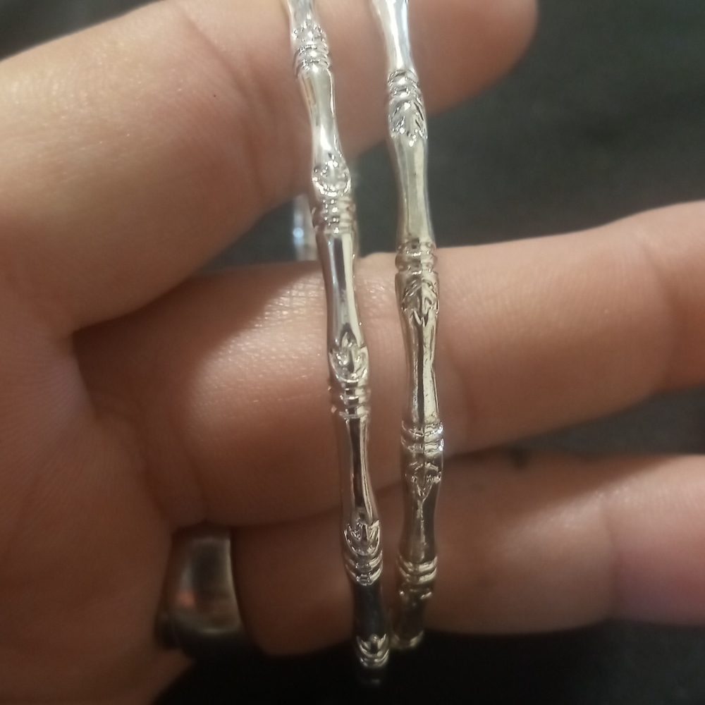 Bamboo style bangle bracelets 2 silver tone with a tiny leaf pattern.